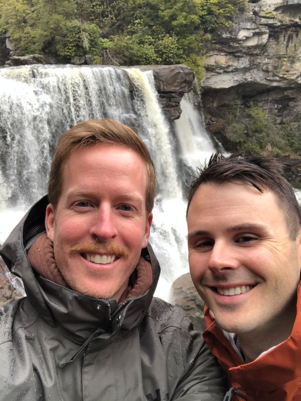 Cheesing In Front of a Waterfall