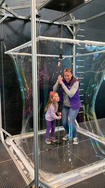 Colleen & Her Niece in a Large Bubble at the Children's Museum